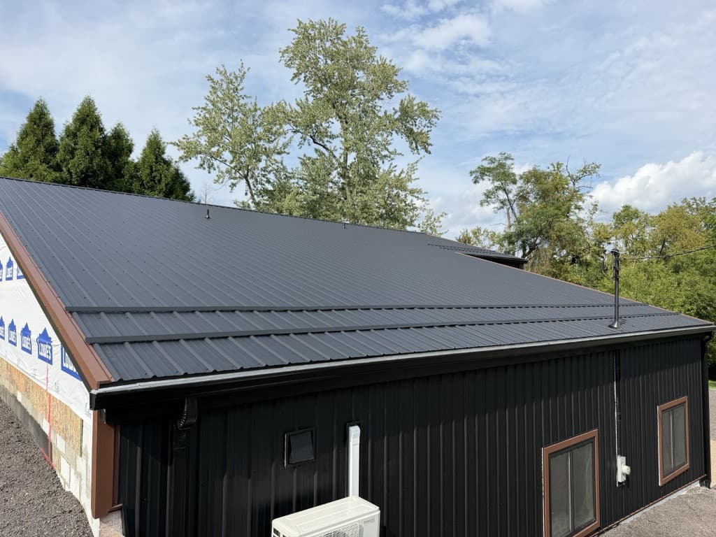 Angled view of corrugated metal roofing on a commercial building