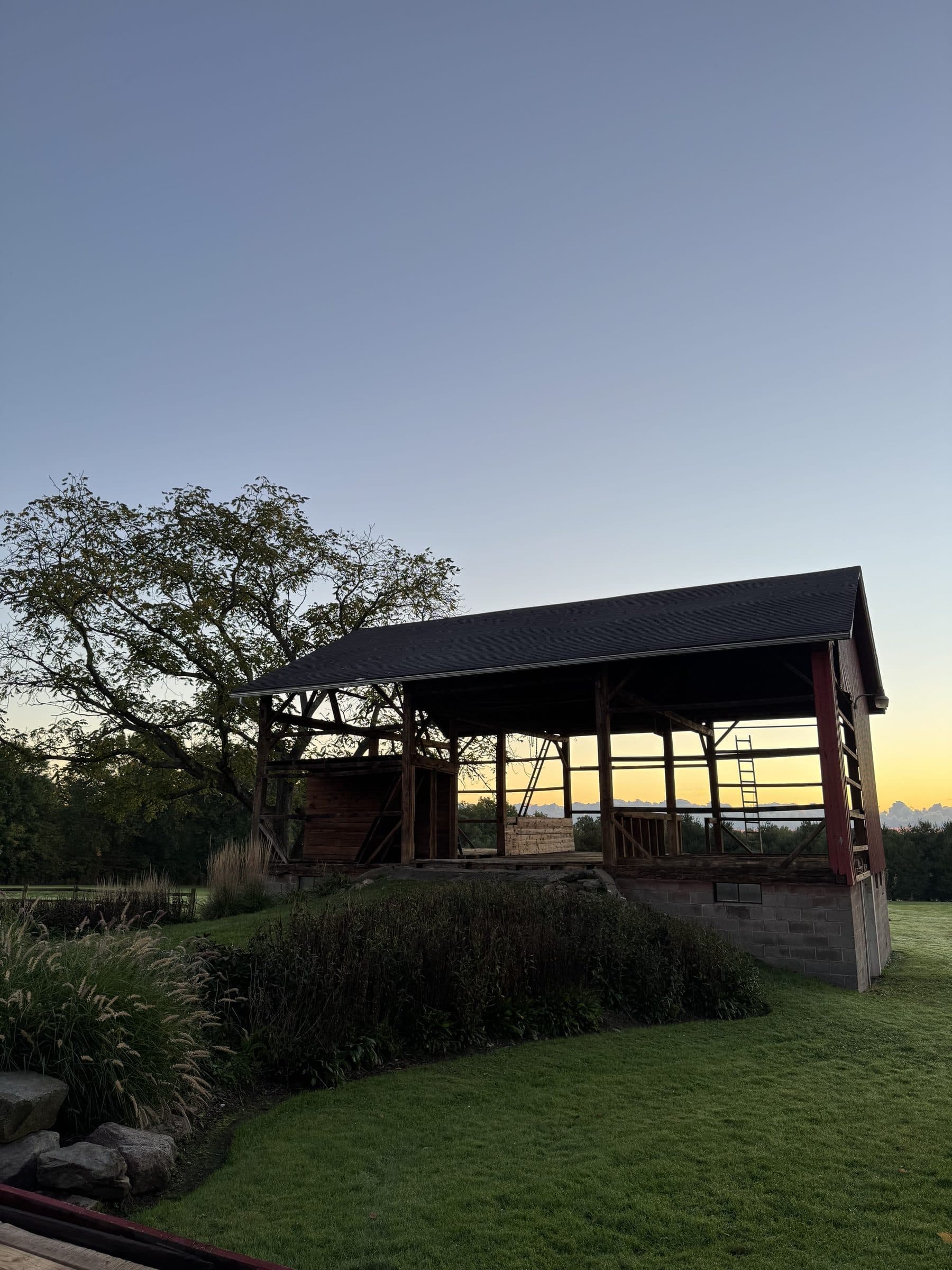 Barn timber frame exposed at dusk